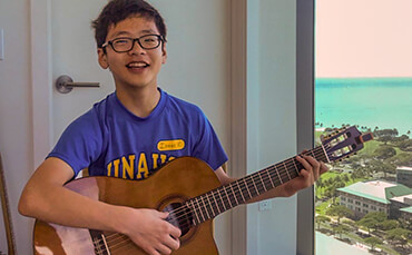 Isac practicing classical guitar